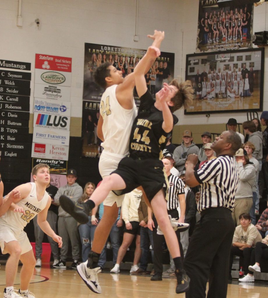 #44 Sayler Skelton goes high for the jump ball at “the Barn.”