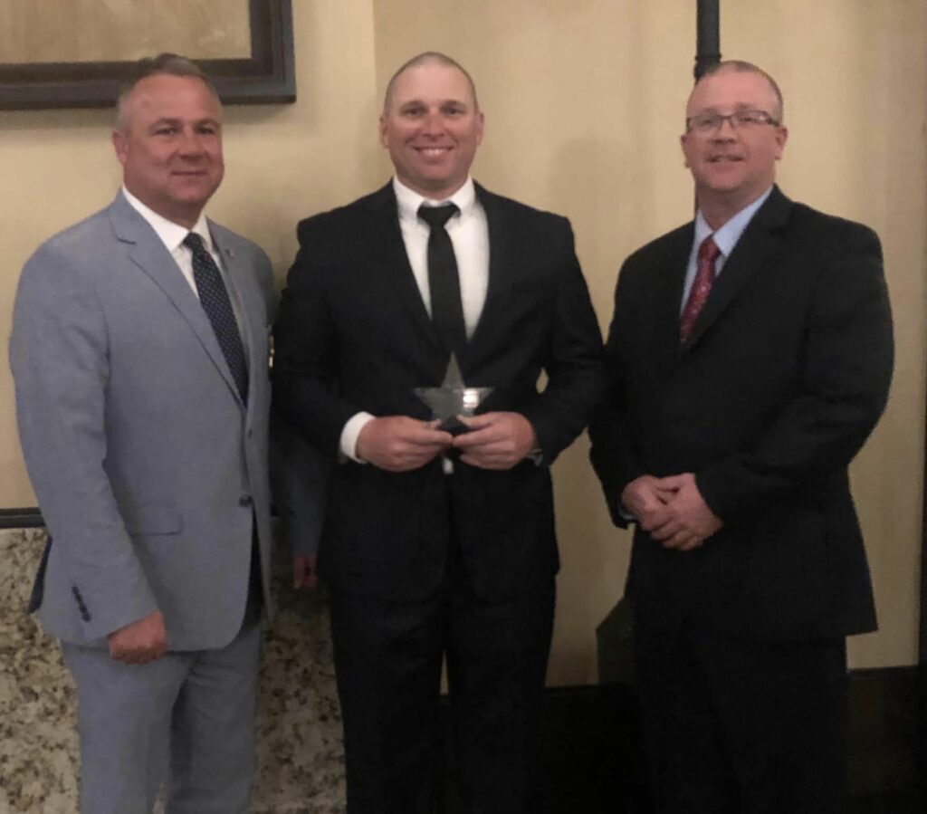    Former Wayne County Sheriff’s Office Investigator Matt Retherford recently received an award for his contributions to children served by A Kid’s Place. Pictured left to right are Sheriff Shane Fisher, Mr. Retherford, and Capt. Tim Beckham of the WCSO. 